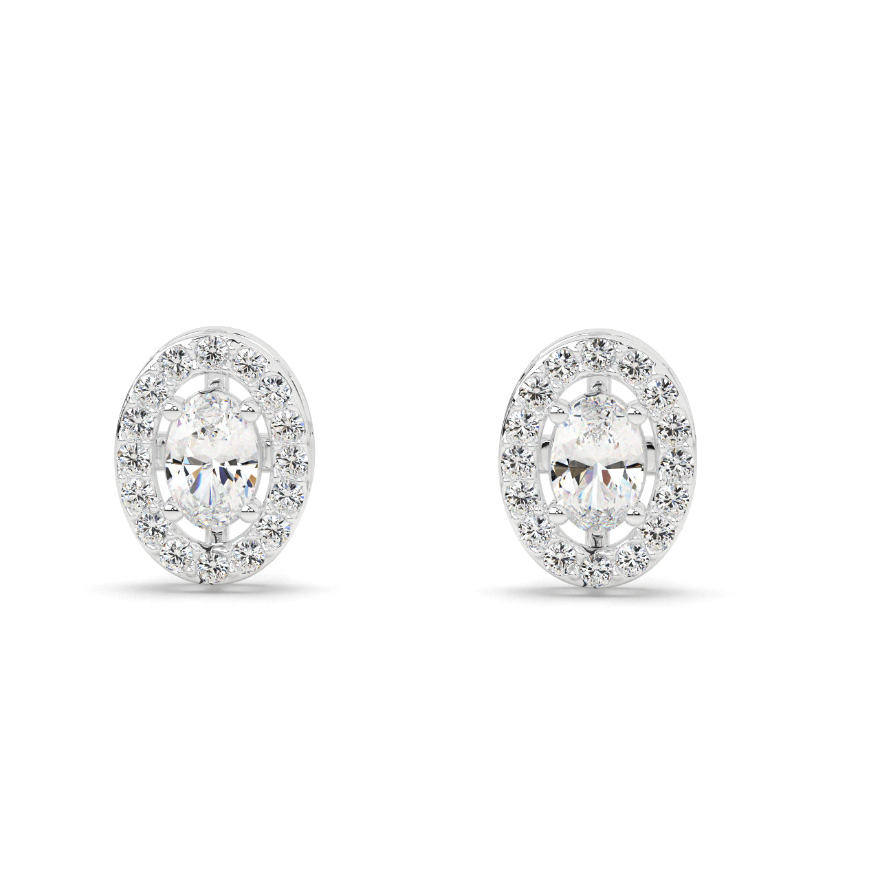 Pair of oval diamond earrings on a white background